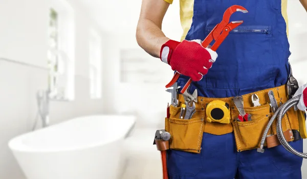 the torso of a plumbing technician showing a tool belt from Emergency Plumber Round Rock in Round Rock, TX - Sewer Line Clearing Services the torso of a plumbing technician showing a tool belt from Emergency Plumber Round Rock in Round Rock, TX - Sewer Line Clearing Services